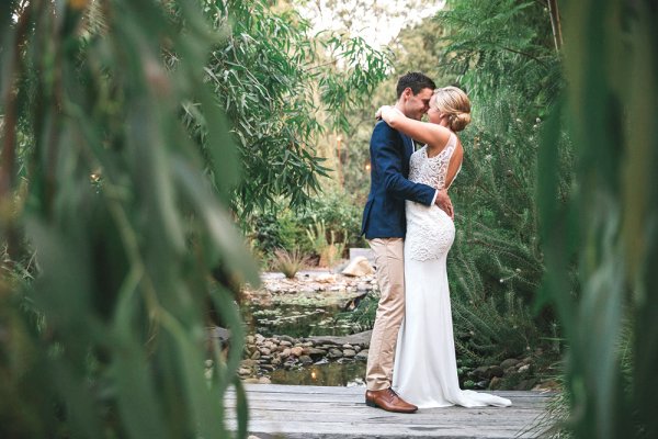 Bride and groom in a garden